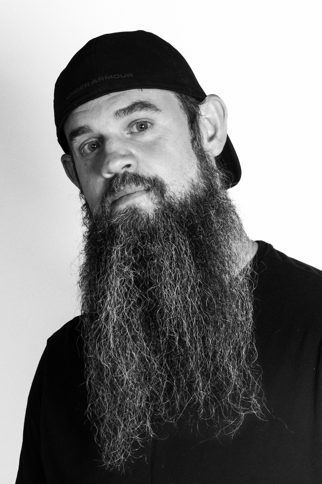 Press portrait. Black and white, plain ground — drops into a listing without fighting it.