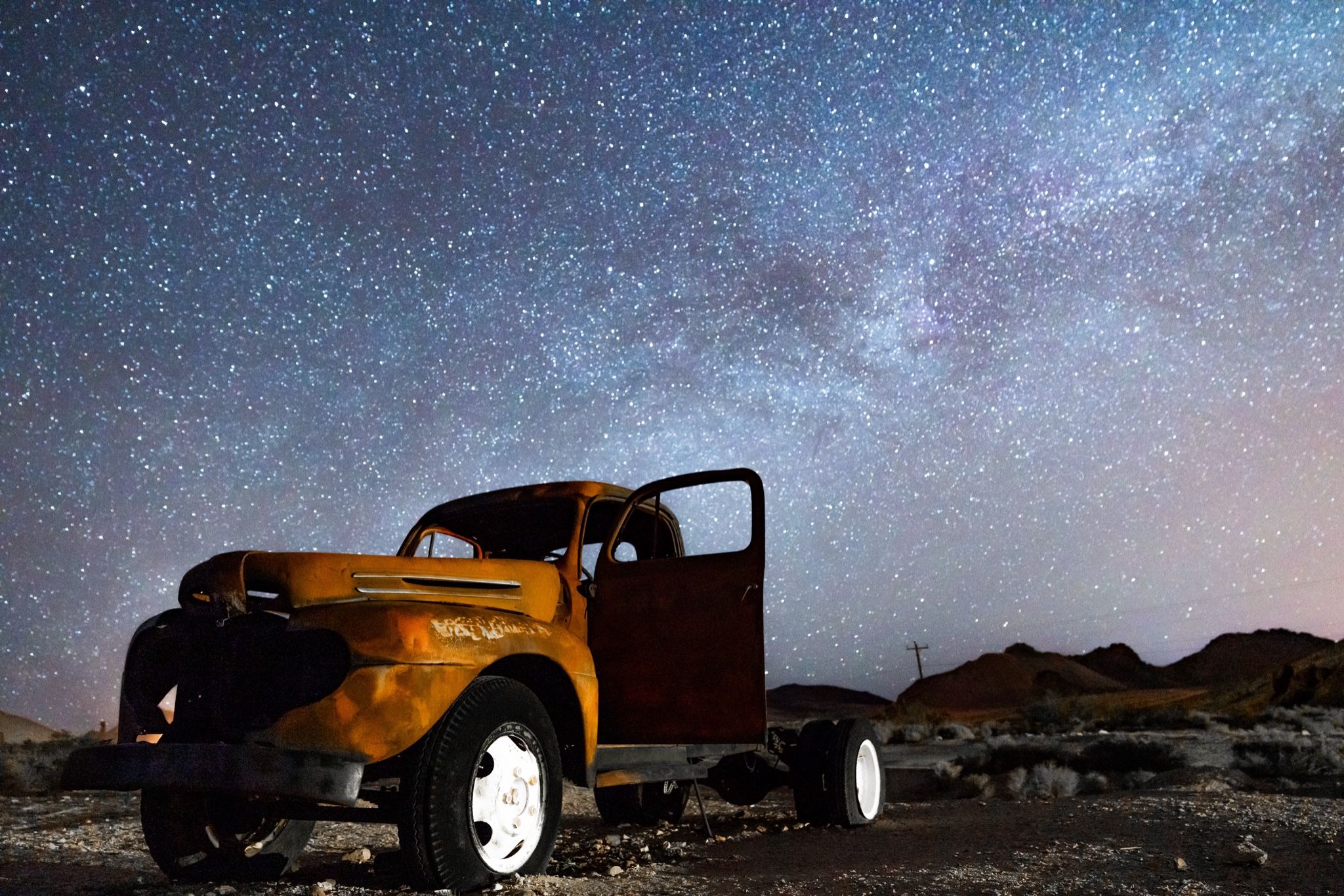 Sodium light on rust, and more stars than the town ever had people.