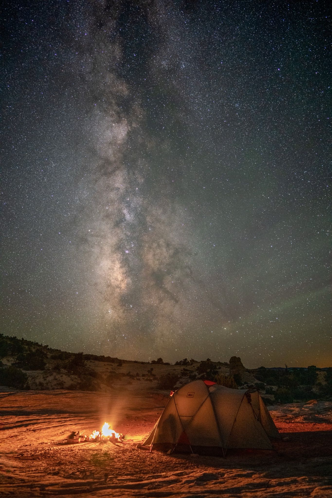 Firelight against galaxy light. The only warm thing for a hundred miles.